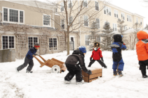 Kindergartners playing in the snow