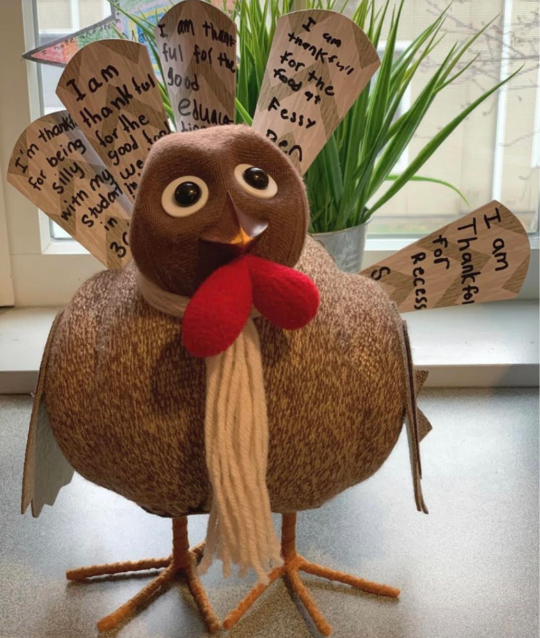 Fessenden boys write what they are thankful for on the turkey's feathers